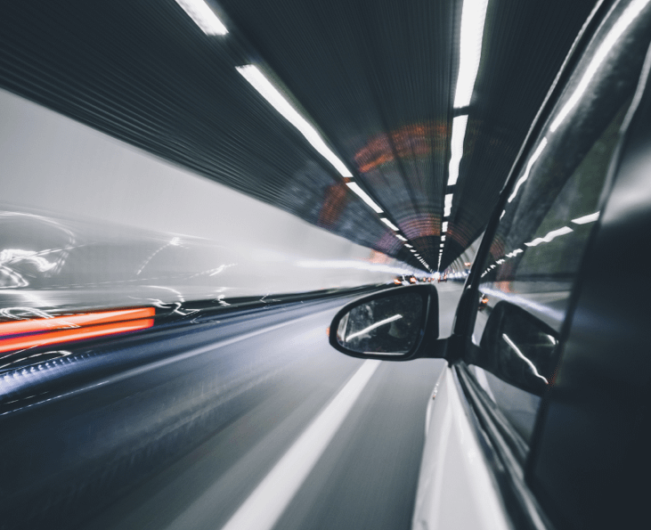 car traveling through tunnel