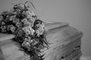 flowers resting on closed casket